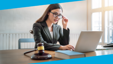 Woman sitting at desk with computer and gavel