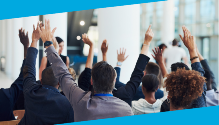 Group of people raising hands